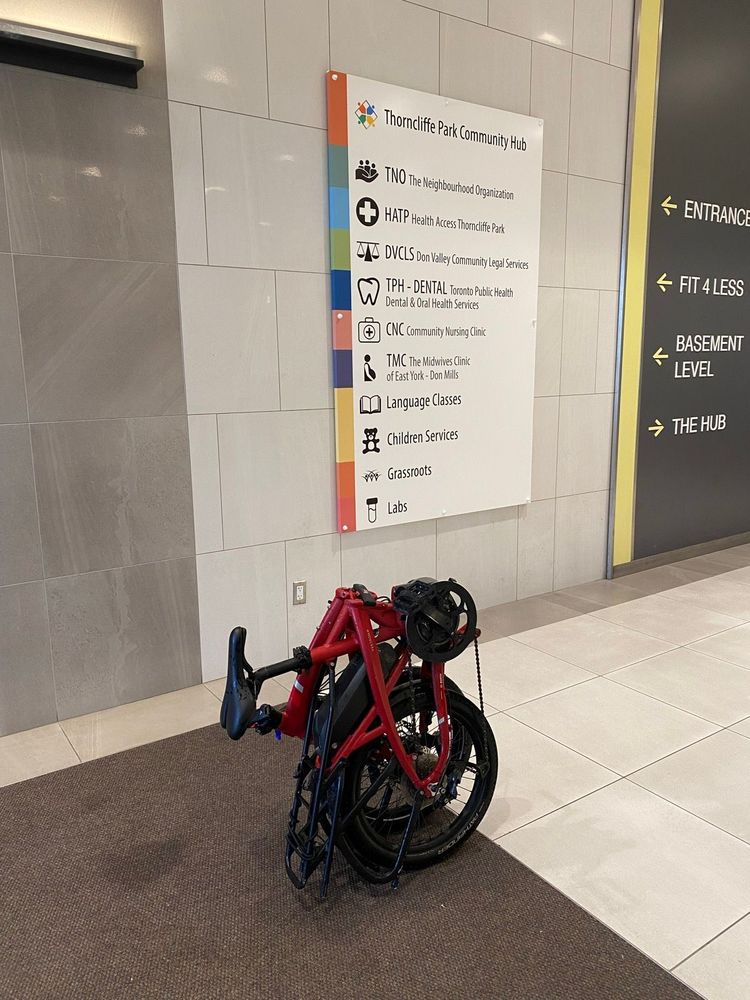 Image of my bike in front of a wayfinding billboard