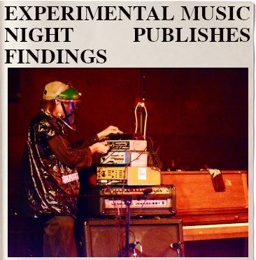 headline: EXPERIMENTAL MUSIC NIGHT PUBLISHES FINDINGS
Image: a guy in a bin bag jacket wearing a sort of home made beekeeping mask adjust the settings on some electronic music device