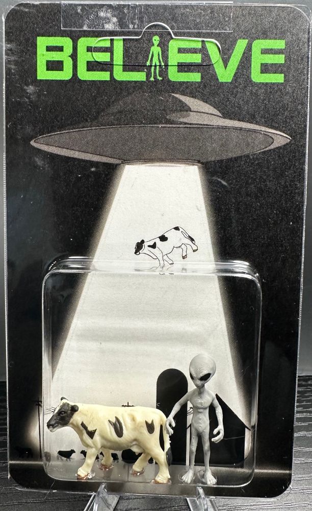 Alien and cow abduction miniature carded figures. 