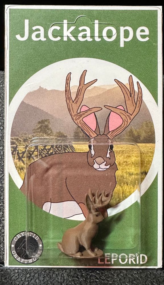 Cryptid Craftwork Jackalope mini figure and custom card back. 
