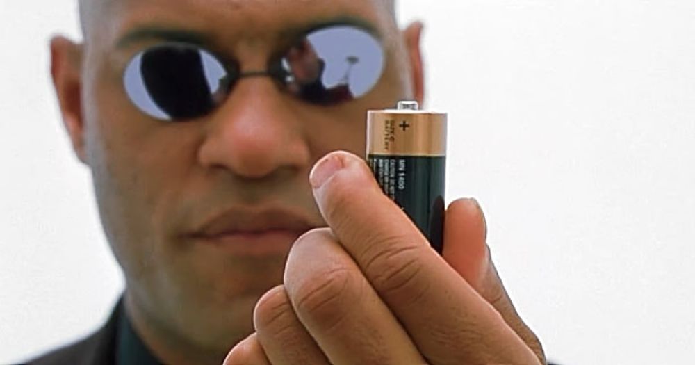 Laurence Fishburne as Morpheus (“The Matrix”) holding a battery (a technology Thiessen is unfamiliar with)