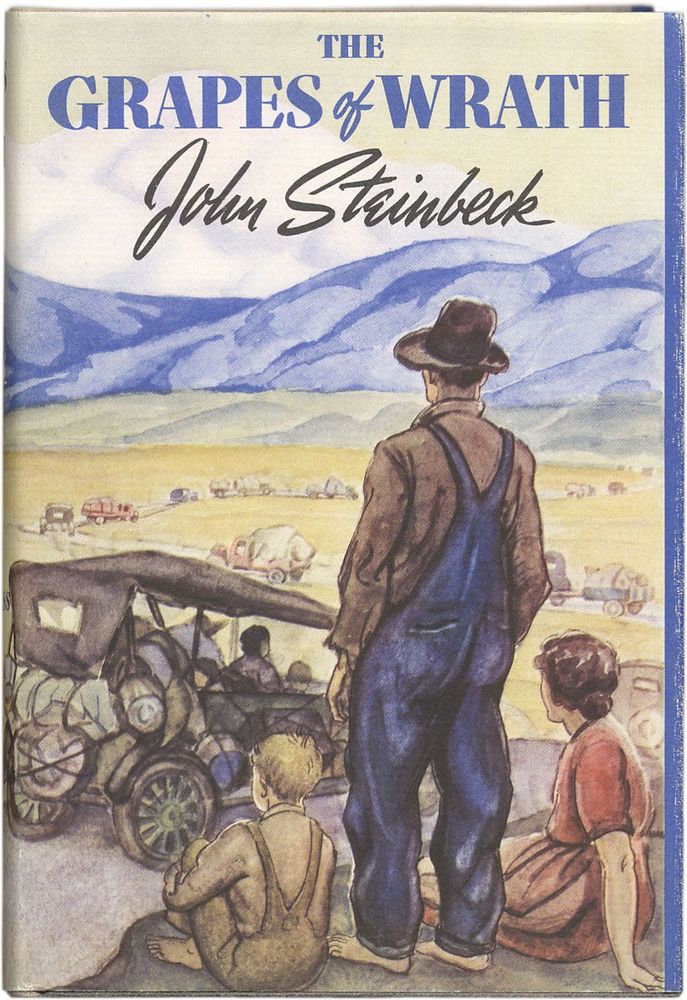 The book cover for The Grapes of Wrath by John Steinbeck. This cover shows a family overlooking a vast landscape. A procession of vehicles makes its way up a winding road through the valley and towards a ridge of mountains.