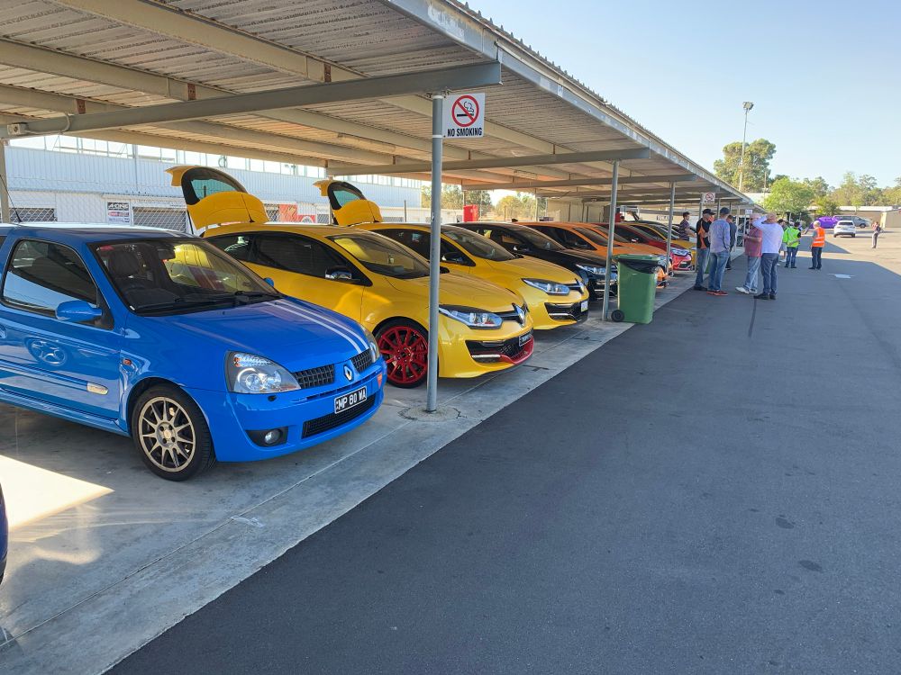 Clio parked next to some other hot Renaults in the garage at Wanneroo raceway.