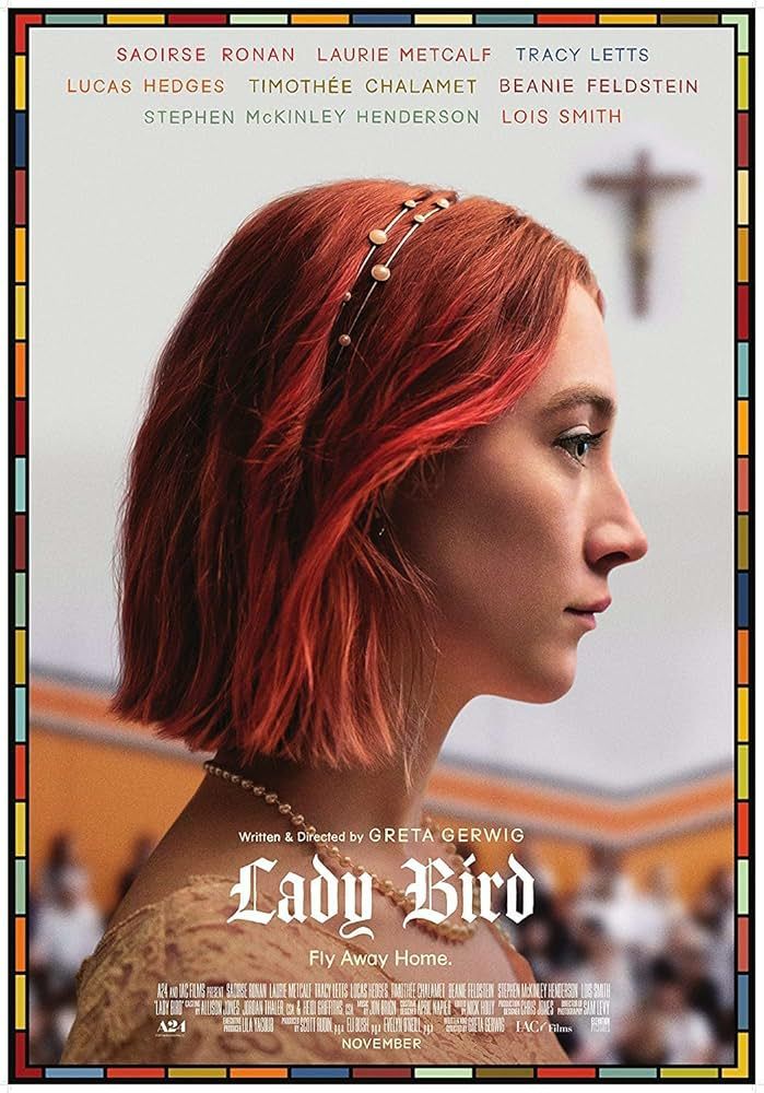 Poster for the film 'Lady Bird' featuring the titular character (played by Saoirse Ronan) stood profile looking to the right. She is a young woman with short, straight red hair, wearing a jeweled headband, a pearl necklace, and a lace dress. Her facial expression is neutral.