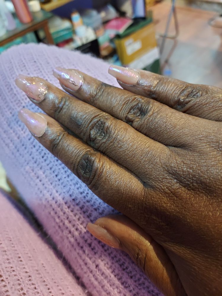 Rose gold roses on a pale peach glitter base. Another short coffin.