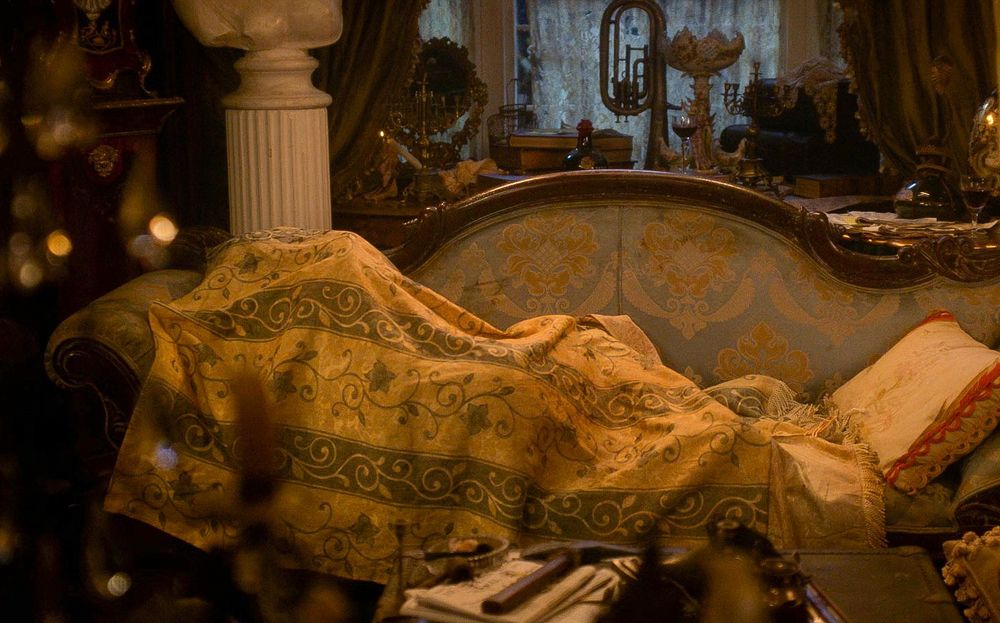 screenshot from OFMD season two episode four that shows Ed under the blanket on the couch