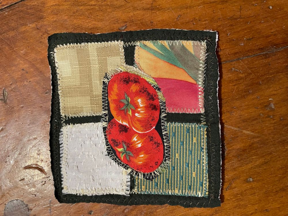 Fabric collage patch. Tomato over four colored squares