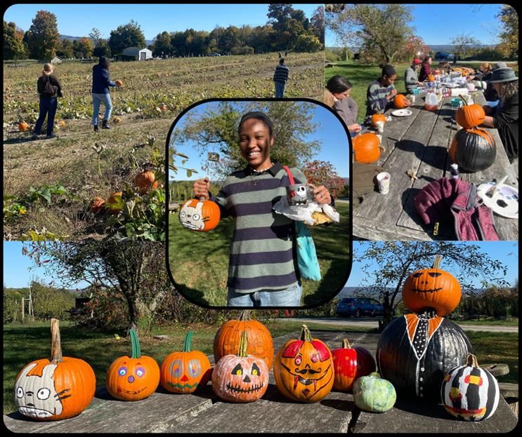 photos of people pumpkin painting outside