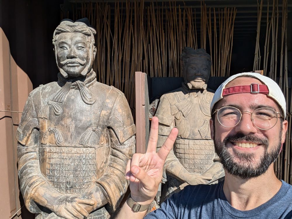 Andrew with two terracotta soldiers, on display in West Seattle.