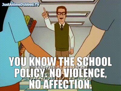 An animated capture from the show "King of the Hill." Bobby and Khan Jr. are holding hands. In front of them, Principal Moss stands pointing accusingly at them and speaking. The caption of his dialogue reads, "You know the school policy. No violence, no affection."