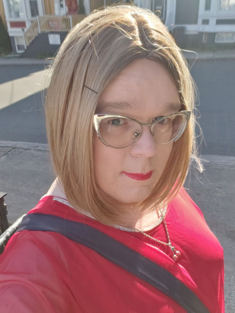 Selfie of a trans lady at a bus stop