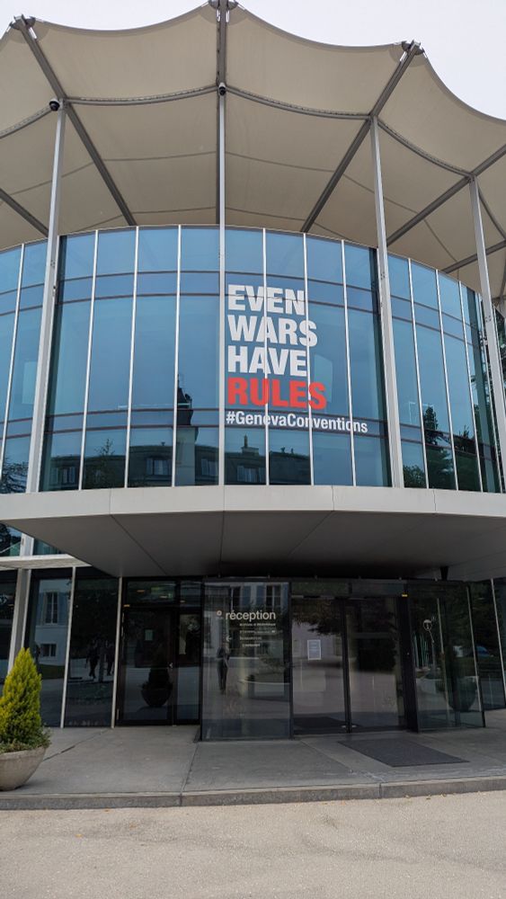 Above the outside of the ICRC the windows have the words "Even wars have rules #GenevaConventions"