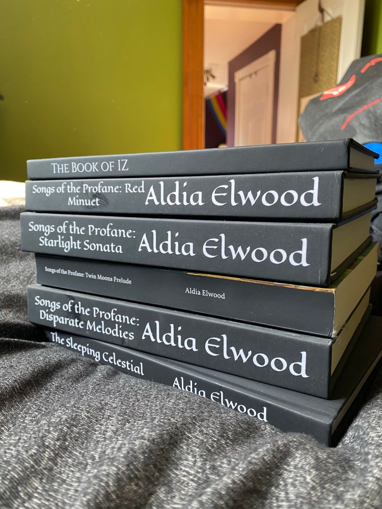 A stack of novels written by Aldia Elwood 