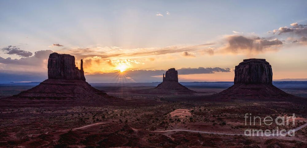 Sunrise Sunrays Over Monument Valley Pano by Jennifer White