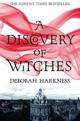 The cover of A Discovery of Witches by Deborah Harkness. The title is prominently displayed in bold black letters, partially intersected by swirling red ribbons of mist that stand out against a white background. Below the title, an image of Oxford’s iconic Radcliffe Camera and surrounding historic buildings is featured in monochrome, evoking a mysterious and scholarly atmosphere.”
