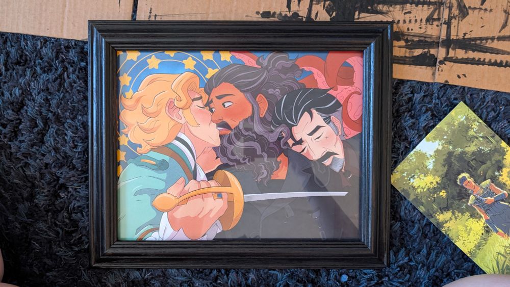 an illustration of Stede Bonnet (L), Edward Teach (M), and Izzy Hands (R) all holding each other. Stede and Ed are almost kissing, Izzy is resting his head on Ed's shoulder, and Stede is holding a sword to Izzy's chest.