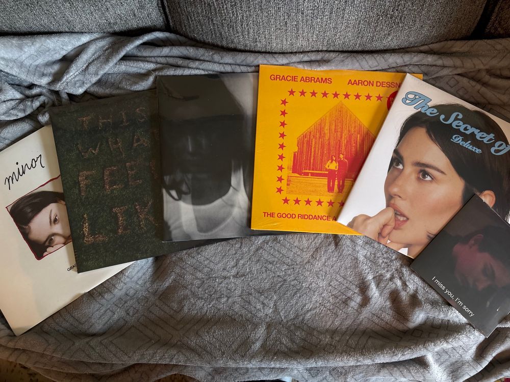 From left to right, vinyl albums from Gracie Abrams - Minor, This Is What It Feels Like, Good Riddance, Good Riddance Live Acoustic, The Secret of Us Deluxe, and I Miss You I’m Sorry/I Love You I’m Sorry