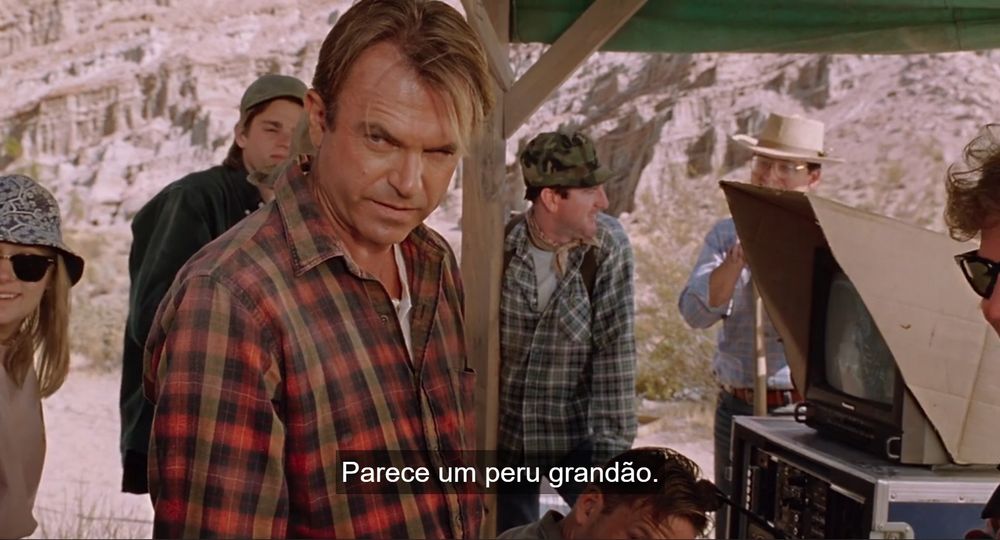 Cena do filme jurassic park onde o ator sam neil está em uma pose que lembra a feição do jair bolsonaro