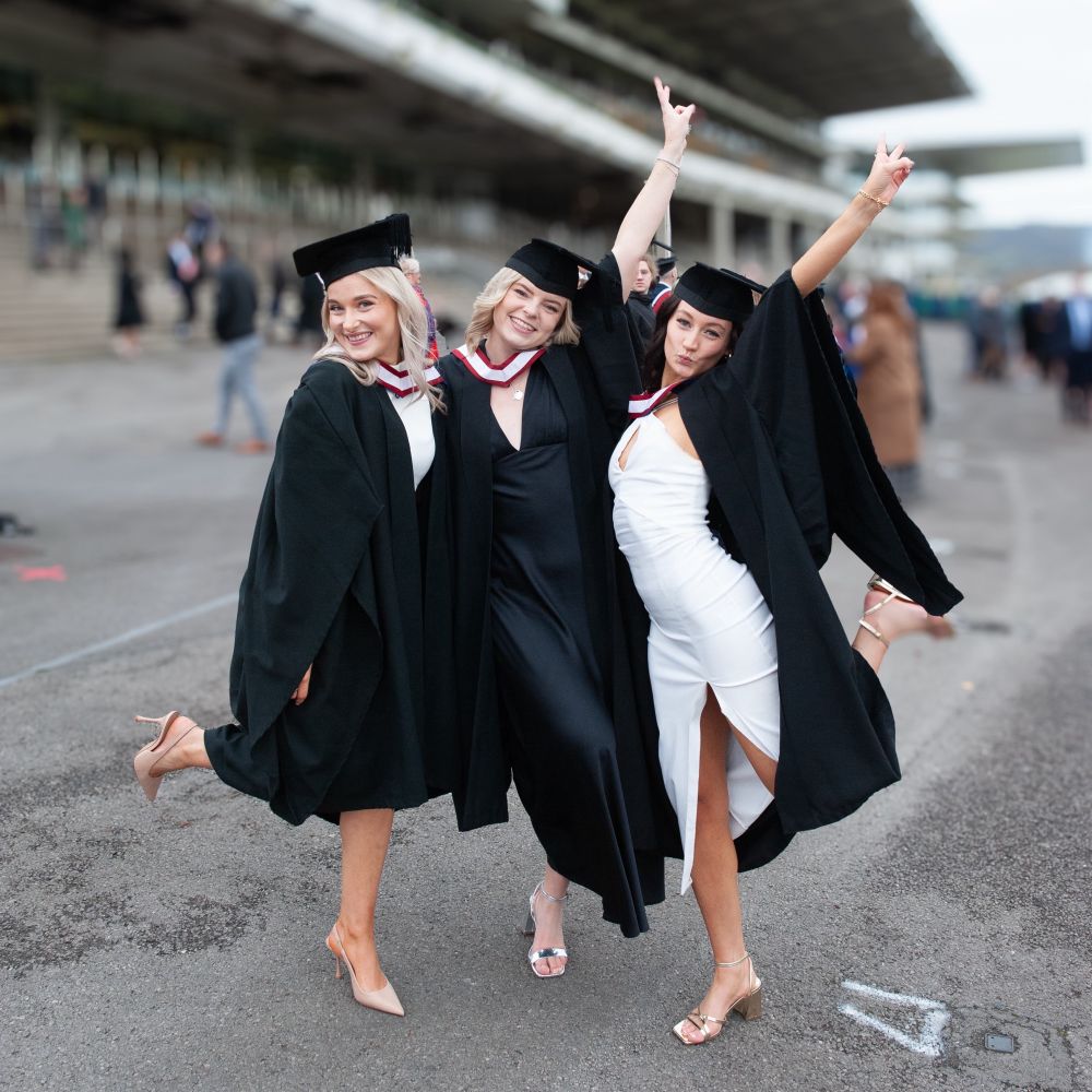 The grads posing for a photo