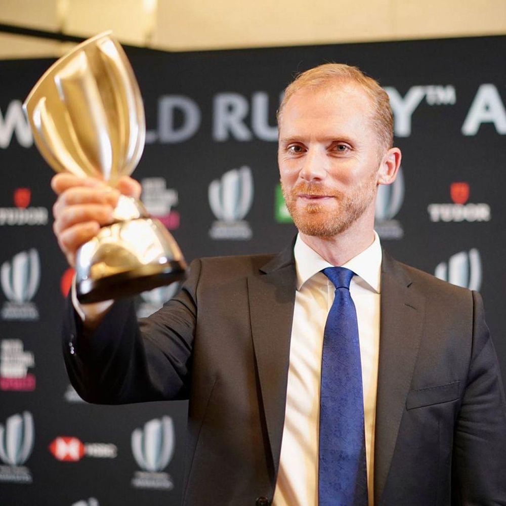 Image of Wayne Barnes holding a trophy