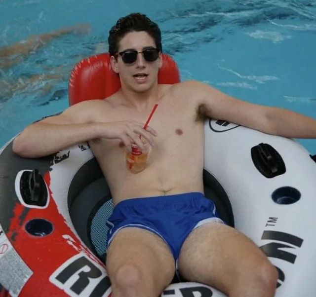 Milo Manheim relaxing in a pool floatie with a drink