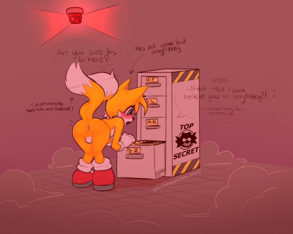 Tails the fox bending over looking through a filing cabinet while an alarm blares. He's saying "Are you sure it's in here? - N-not that I don't believe you or anything!! I've just been looking for a while that's all..."

Descriptive text around him says "He's not gonna find anything" and "(absentmindedly twirls tails when flustered)".