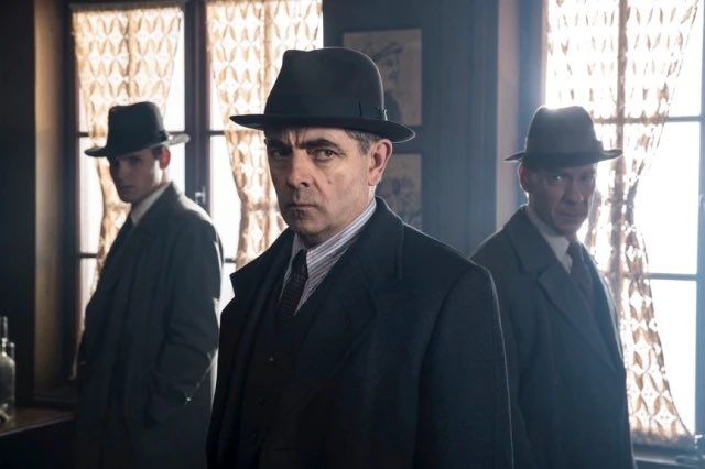 Rowan Atkinson as Inspector Maigret