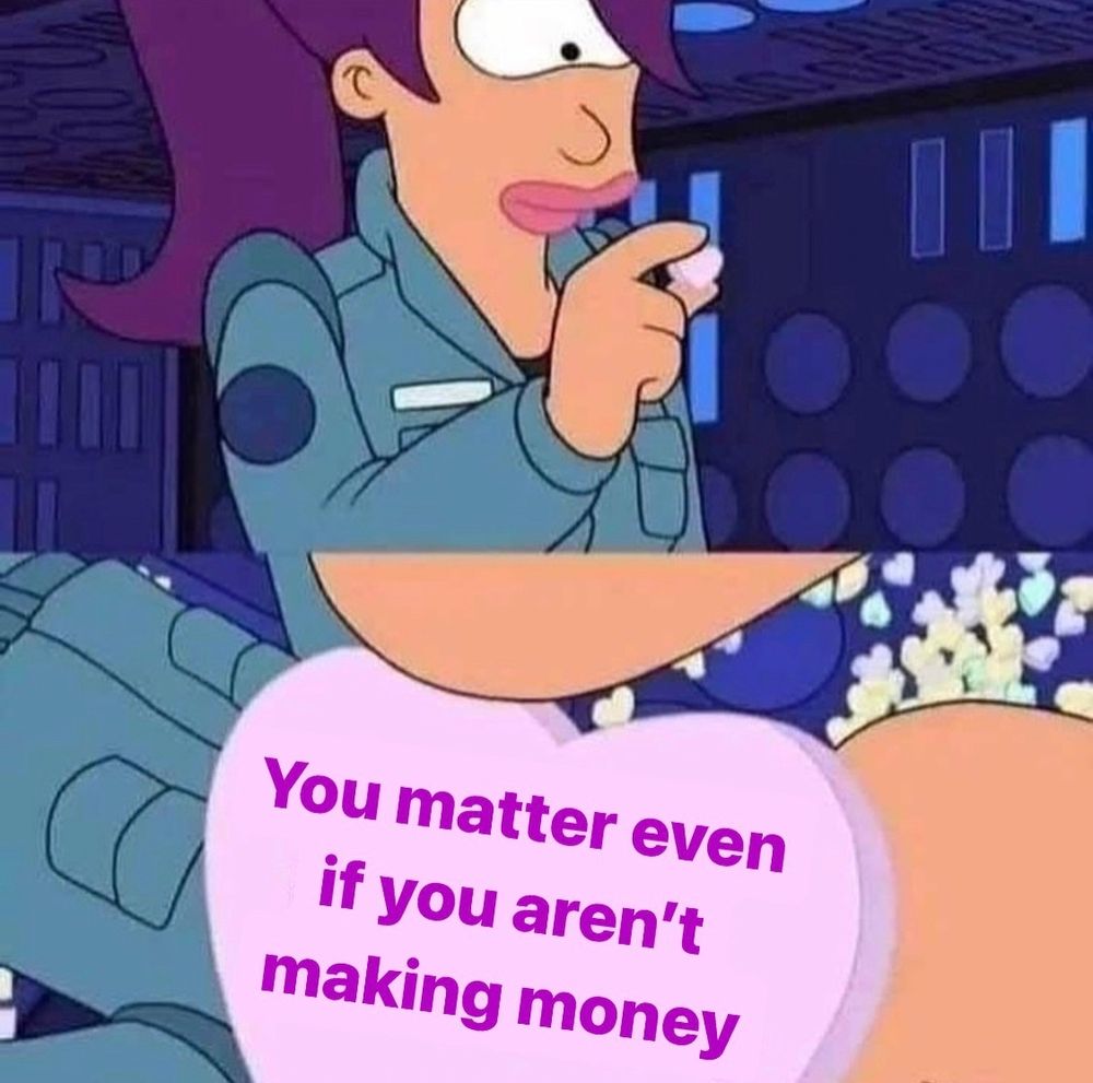 Leela from futurama looks at a candy heart that says You matter even if you aren't making money