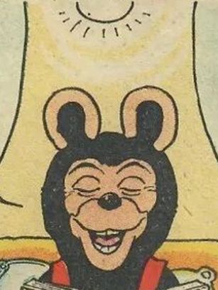 it's biffo the bear making one of his horrible faces with a light shining down on him from above