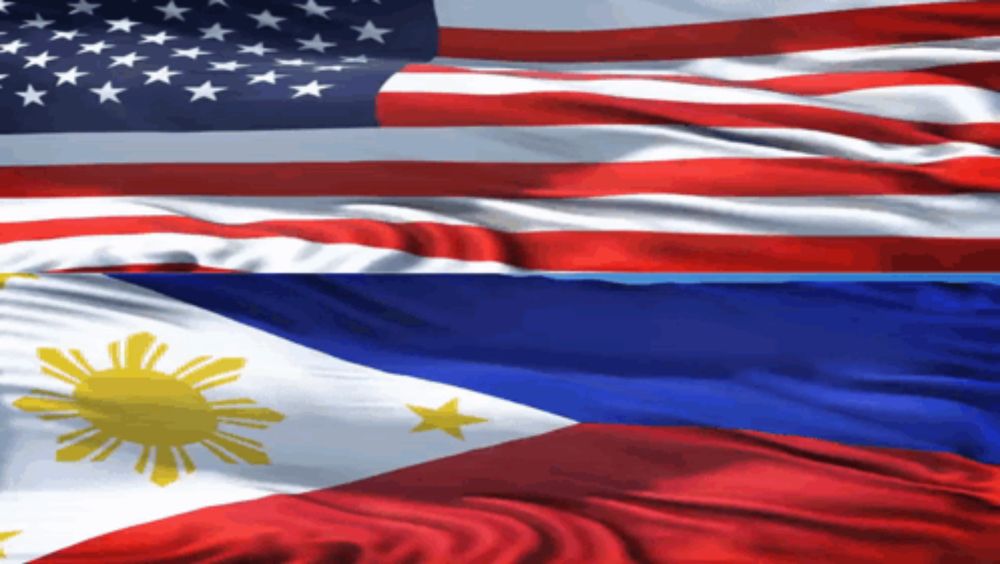 an american flag and a filipino flag are waving together