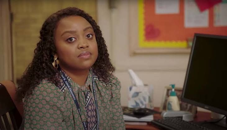 Quinta Brunson looking into the camera 