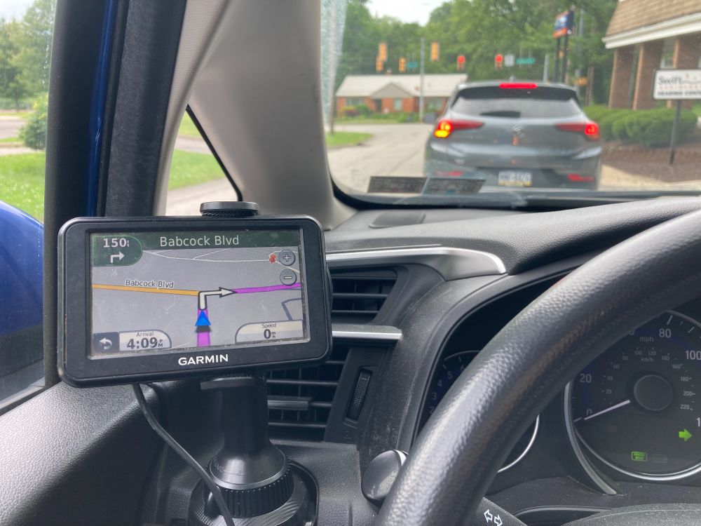 at a red light, a GPS unit mounted to the left of my steering wheel