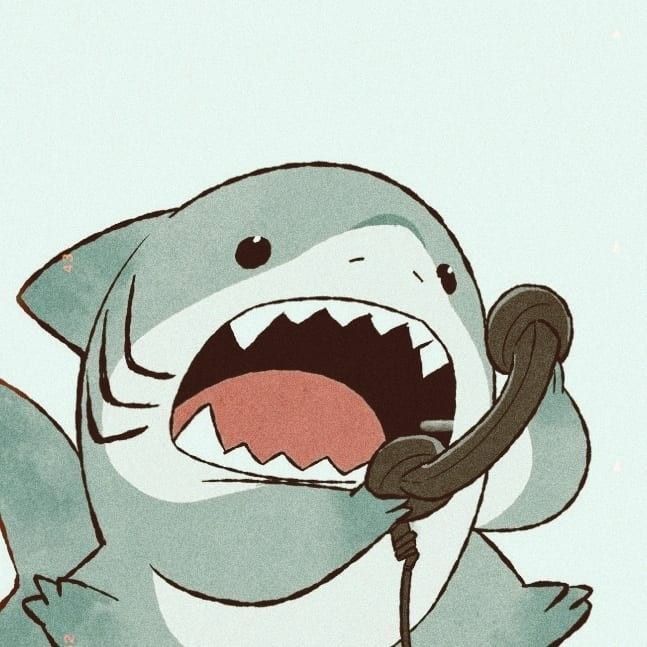 Jeff the Landshark talking into a phone enthusiastically 