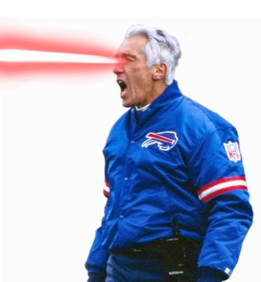 an image of marv levy in the blue nineties windbreaker against a white background. He seems to be yelling and there are rwd lasers firing from his eyes toward the left of the screen. 