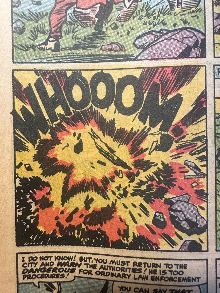 a panel by Jack Kirby and Chic Stone of an explosion. the sound effect says “WHOOOM!”
