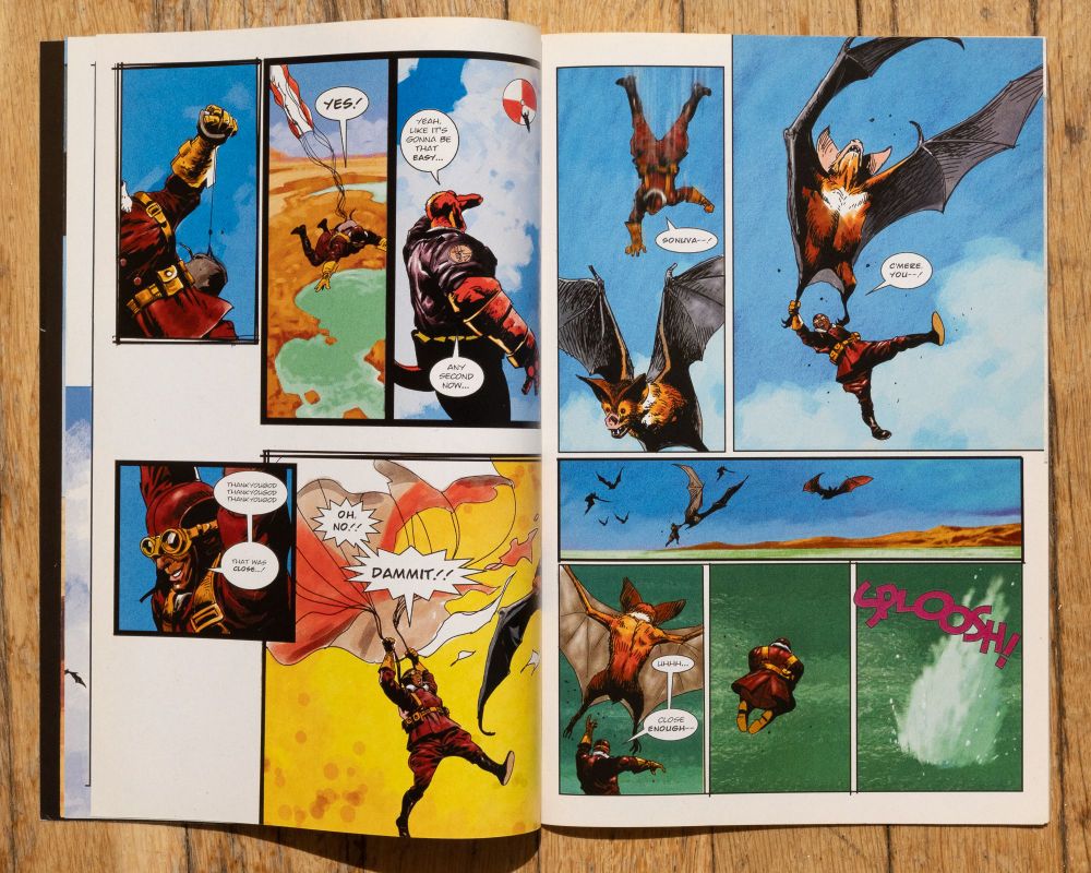 a spread from a Hellboy comic by Steve Parkhouse written by Joe Casey. A man with a jetpack is being attacked by giant bats while Hellboy looks on from the ground