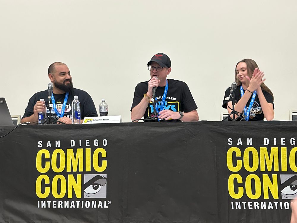 3 people
On a comic con panel