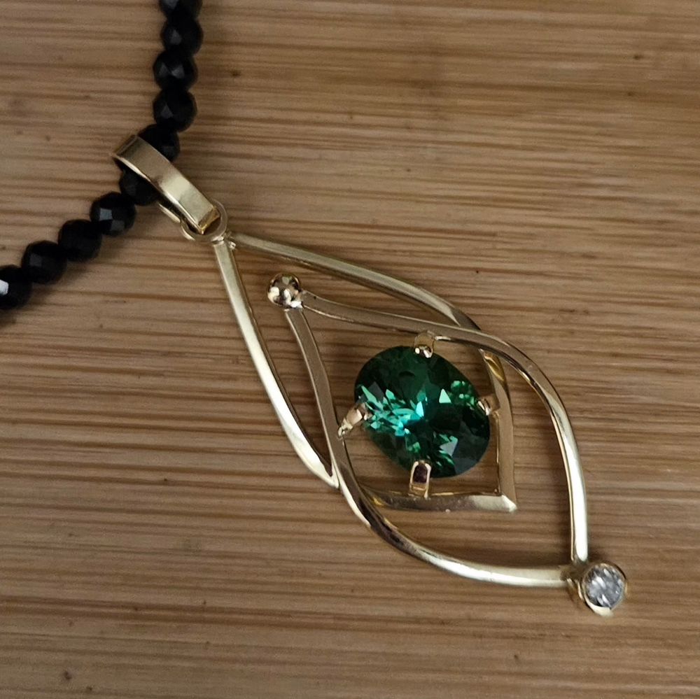 A green tourmaline from Nigeria set in a handmade 18kt gold pendent. By jeweler Stacia Woods jewelsbystacia.com