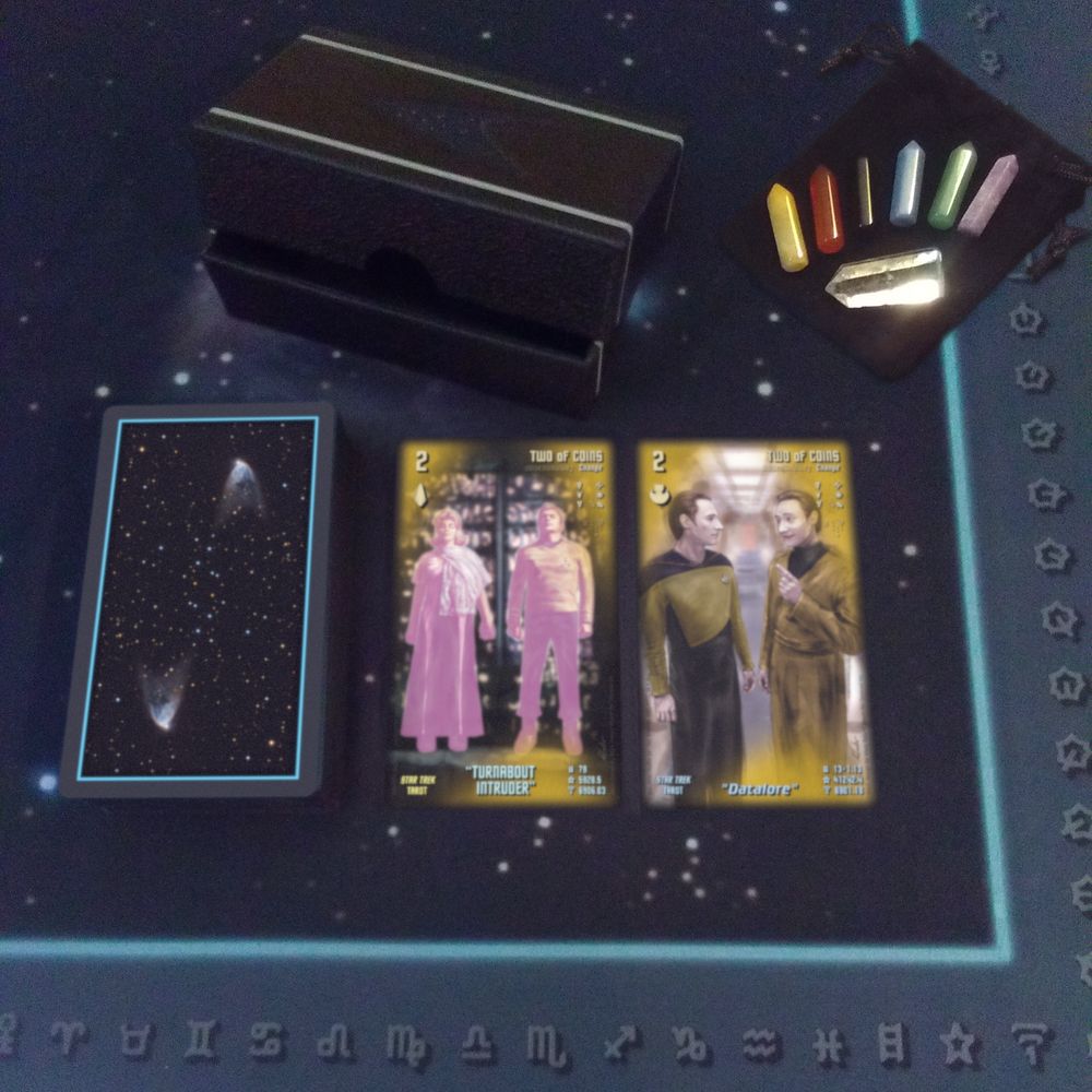 Telekiad's Star Trek Tarot, displaying its TOS and TNG (Set 1) Two of Coins cards, along with a Telekiad Tarot Spread Cloth and a Telekiad Tarot Gemstone/Crystal Set.