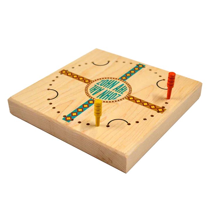 A modern recreation of Zohn Ahl on a wooden block with colourful patterns along with a red and a yellow peg inserted into 2 spaces.