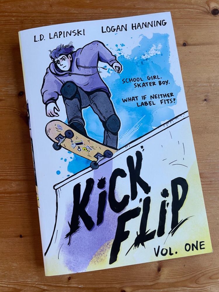 The graphic novel, the cover of which shows a teenager wearing a light purple hoodie and dark grey jeans on a skateboard perched at the top of what I’m sure has a proper skateboarding term but to me is a drop.