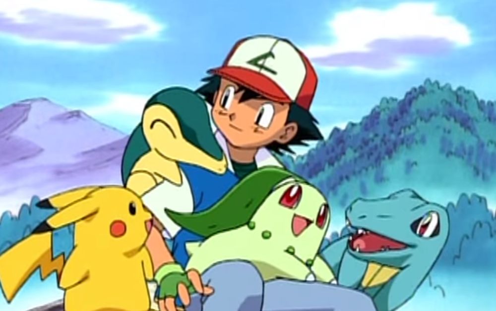 Ash sitting with Pikachu, Totodile, Chikorita and Cyndaquil in the Johto anime opening.