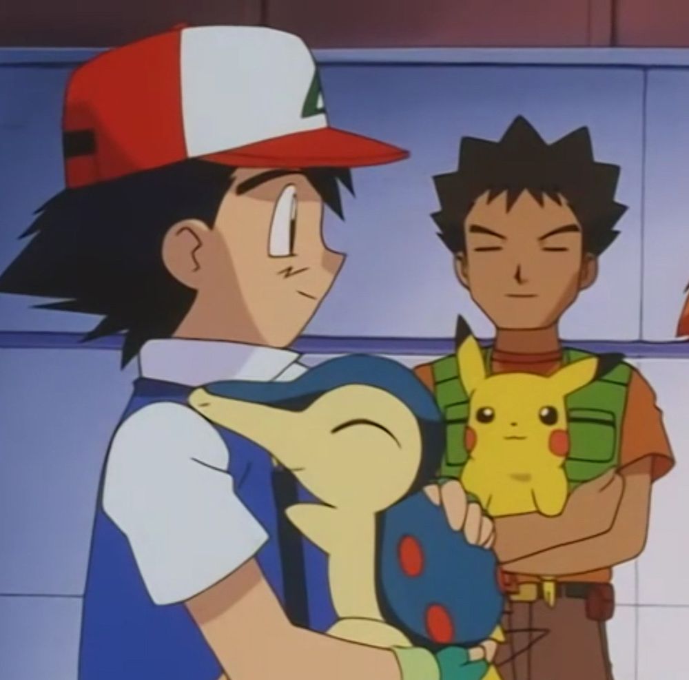 Anipoke, Ash hugging Cyndaquil and Brock hugging Pikachu.