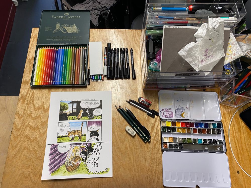 Desktop picture of the artwork and most of the tools used to make comic.