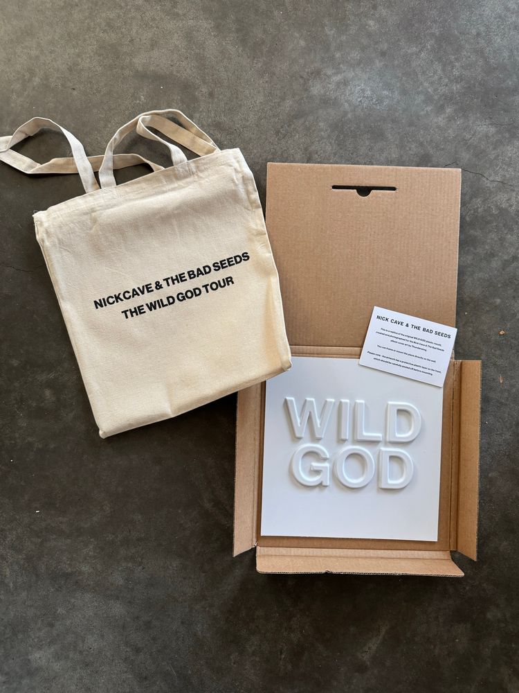 Tour souvenir tote bag and replica art for the cover of Nick Cave and the Bad Seeds' album Wild God. 