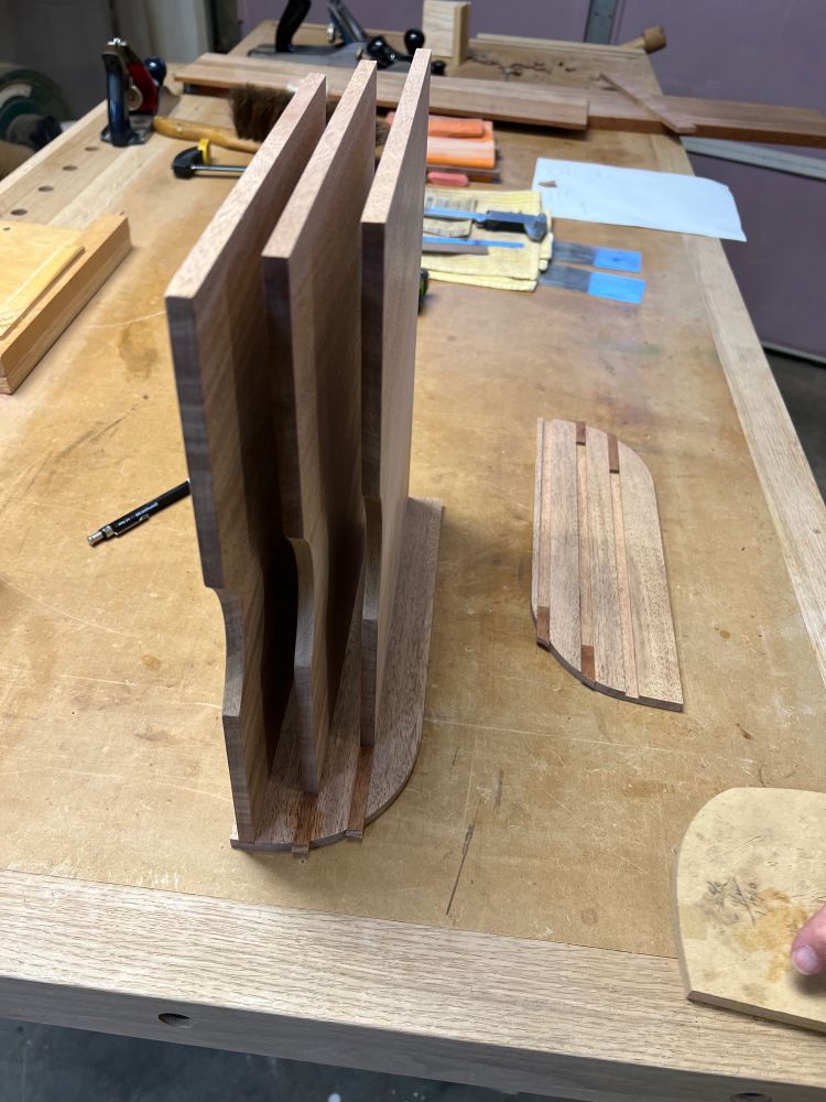 Half of a paper organizer on its side vertically waiting to be glued and sanded