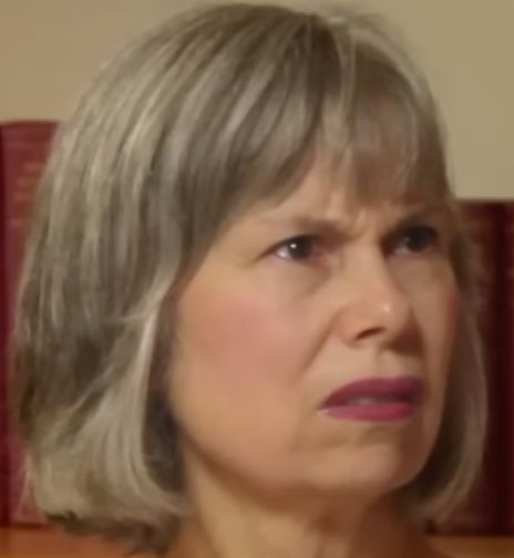Mary Knight, an older white woman with a grayish-blonde bob, looking openly disgusted.