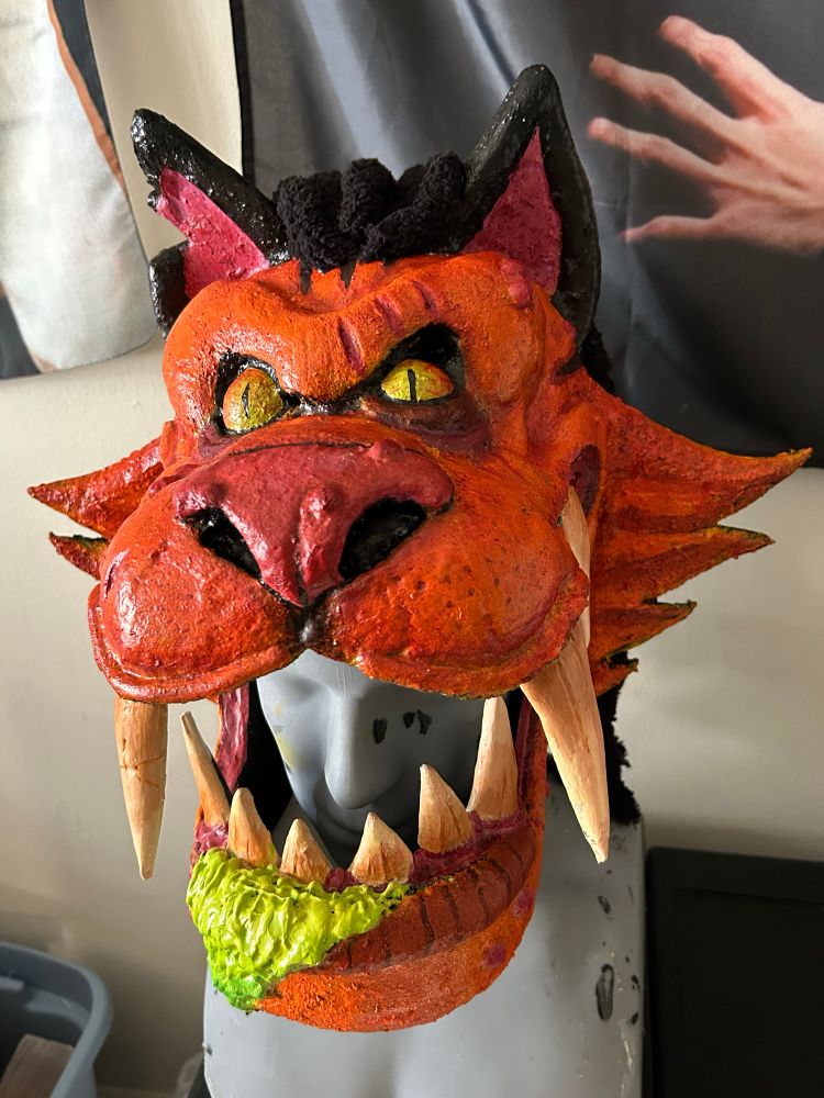 GWAR inspired costume mask of a cat. Grotesque, cartoony, and puking green slime.