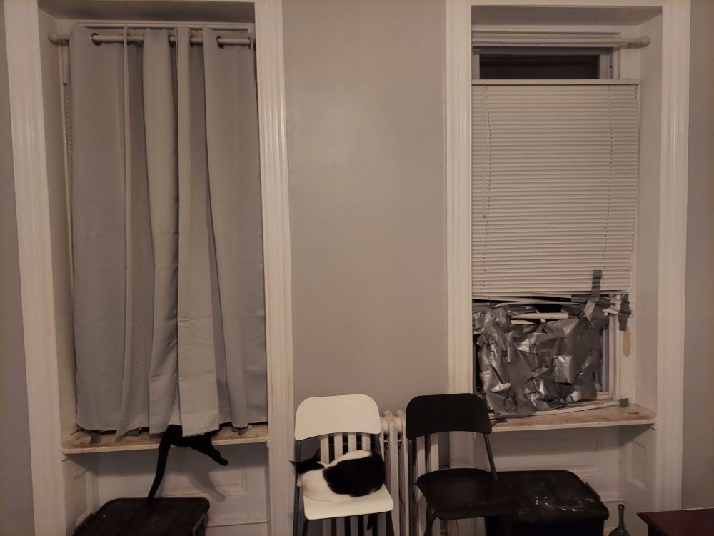 New drapes installed on left window. Blinds not removed yet (they're behind the drapes).