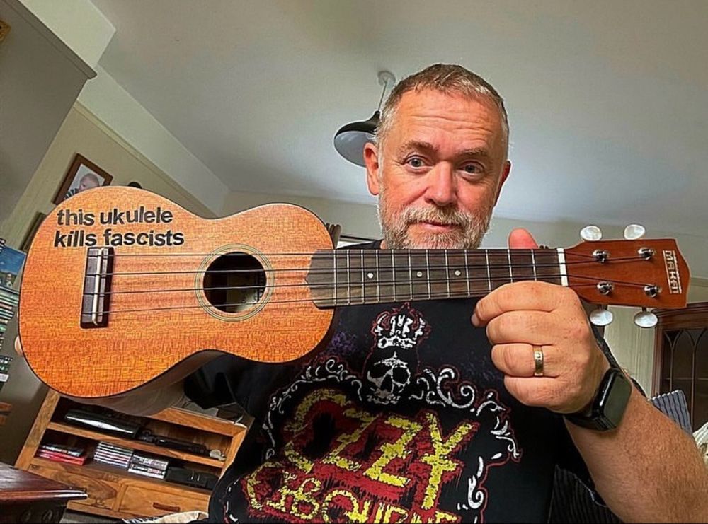 Holding my ukulele wearing an Ozzy Osbourne T-shirt 
